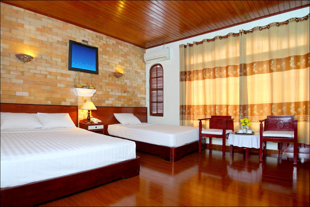 Nhi Trung Hotel Хой Ан Стая снимка