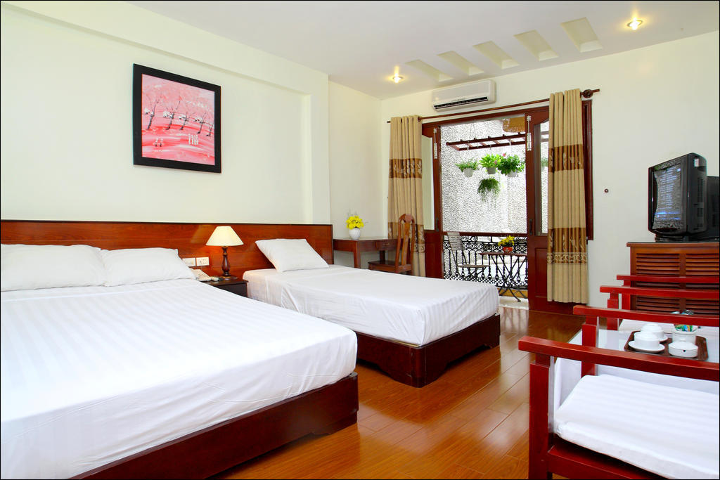 Nhi Trung Hotel Хой Ан Стая снимка